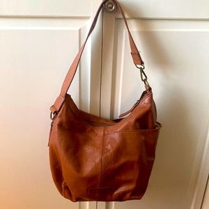 genuine leather lucky bag. 13”w x 10”h. 10” strap height